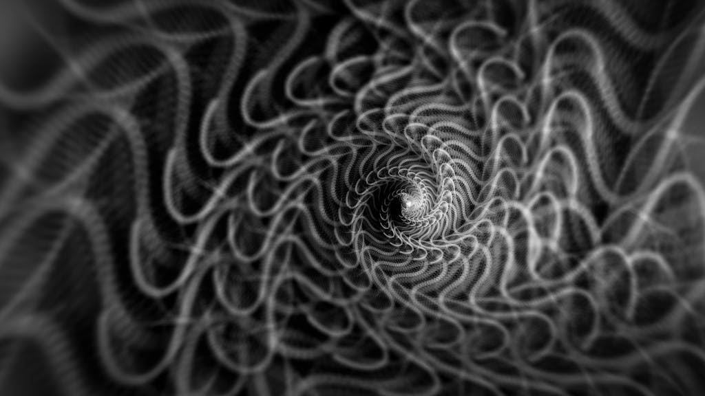 A mesmerizing black and white abstract spiral pattern creating a sense of depth and motion.